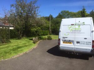 green scenery van in a garden in Preston